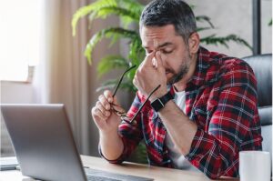 man with strained eyes