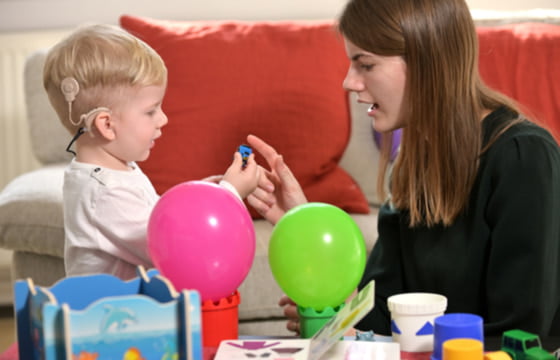 mother and little boy with hearing aids