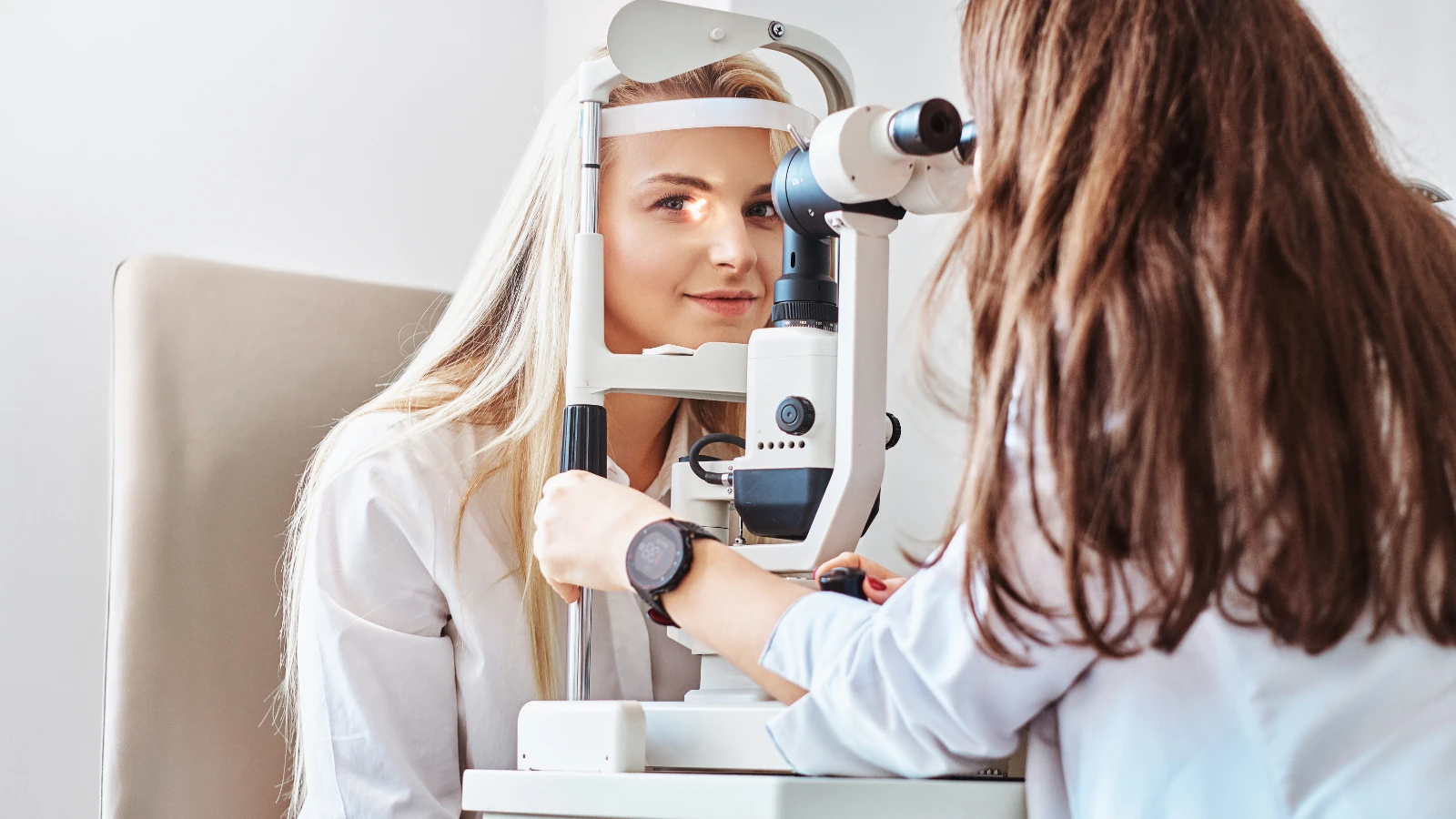 young woman during eye exam and vision test