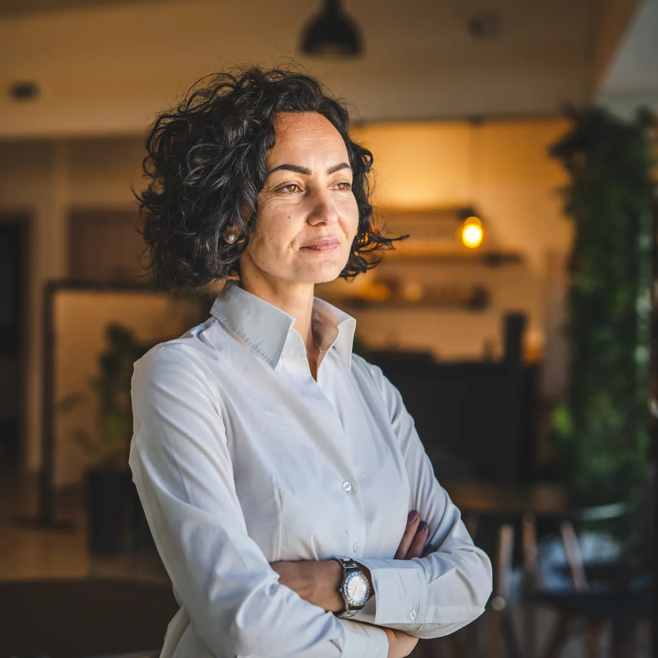 middle-aged businesswoman looking out the window