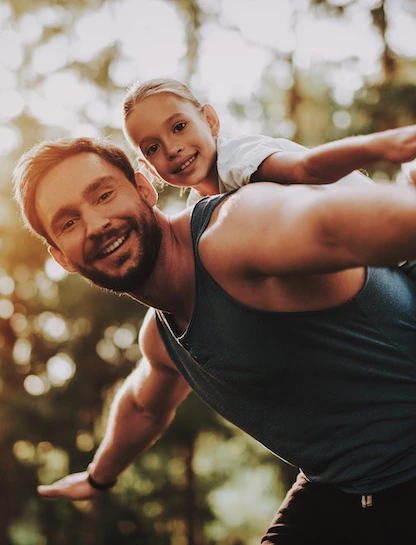 dad and daughter playing outside