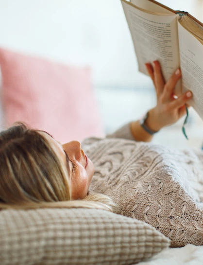woman reading a book without glasses