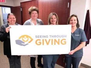 seeing through giving group photo