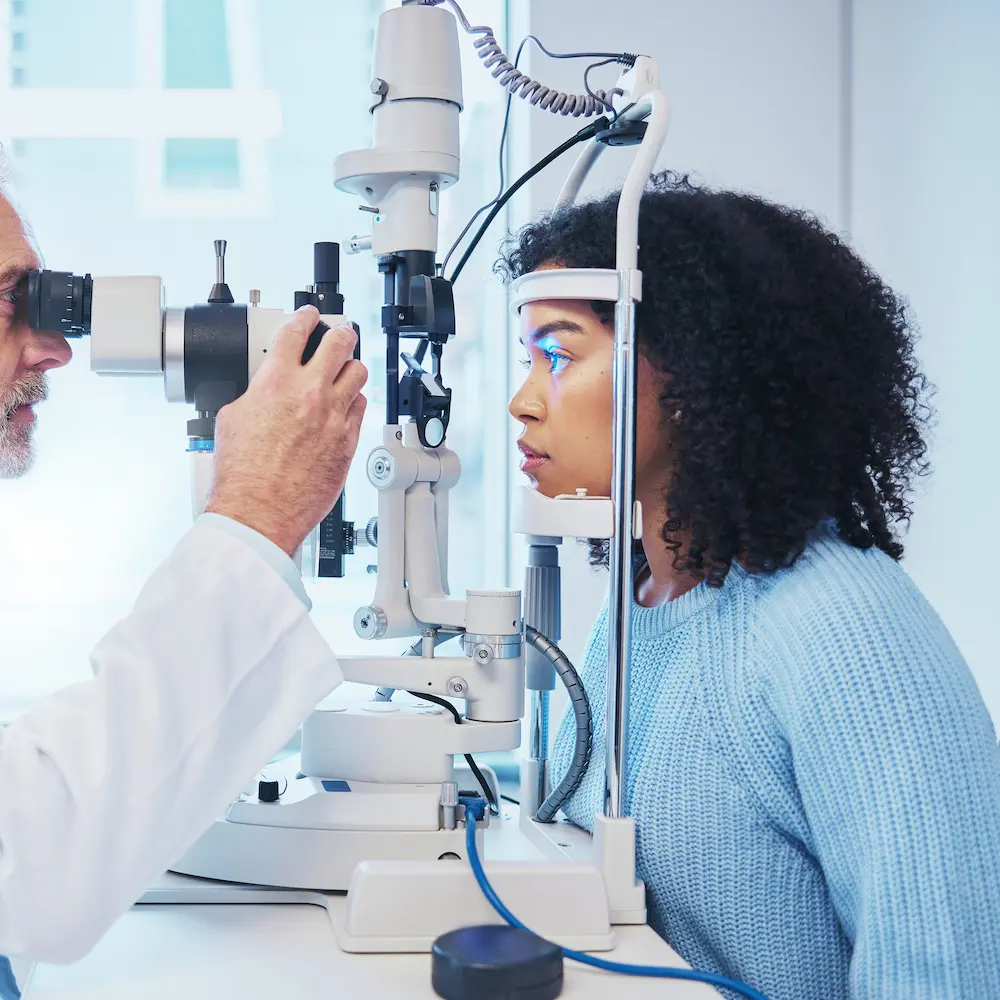young woman during her eye exam for her vision correction consultation
